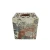 Drewniane pudełko na chusteczki ozdobione motywem kwiatowym  na tle starych gazet, z zielonymi liśćmi i czerwonymi kwiatami, a na górze ażurowe wieczko z okrągłym otworem na chusteczki.